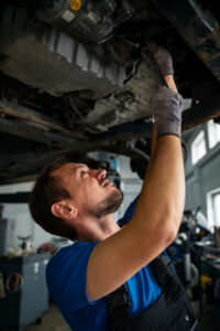male-mechanic-working-car-auto-repair-shop